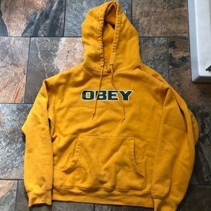 Yellow Obey Hoodie with Green Lettering
